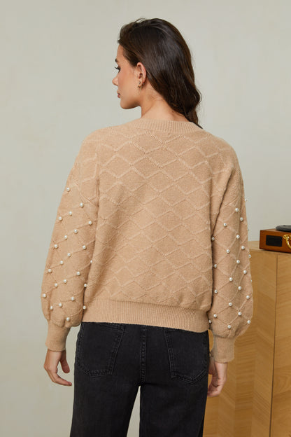 Pull surpiqué avec perles