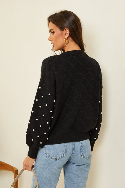 Pull surpiqué avec perles