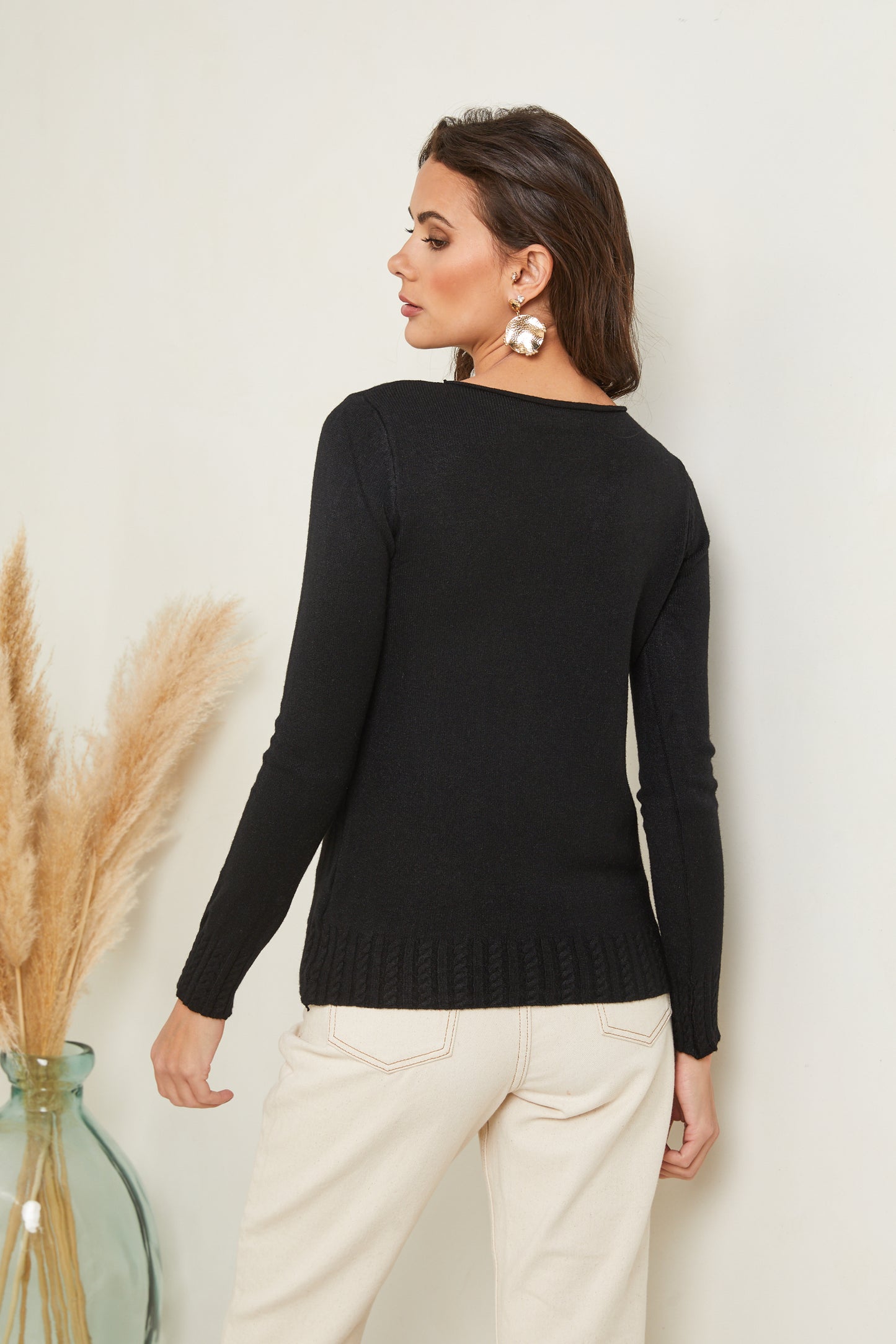 Pull col rond avec détails torsadés